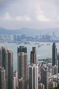 high rise buildings near body of water thumbnail