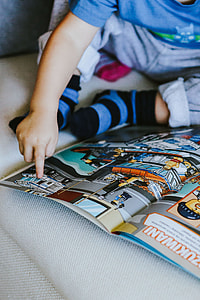 Child reading a comic story thumbnail