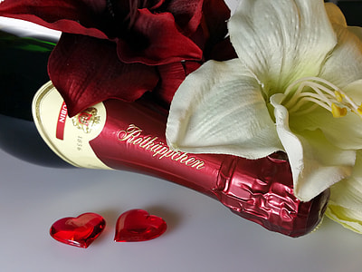 green glass wine bottle with red cap thumbnail