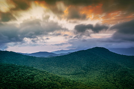 landscape photo of mountain with green trees thumbnail