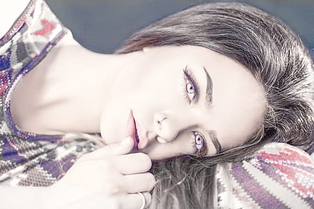 close-up photo of a woman wearing purple contact lenses thumbnail