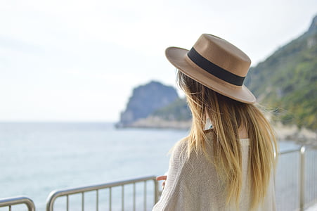woman standing near body of water thumbnail