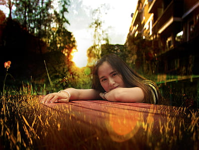 woman leaning on brown dock thumbnail