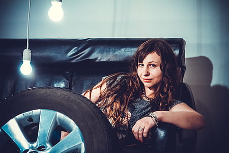 Photo of Woman Sitting on Couch Front of Wheel thumbnail