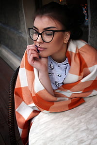 woman sitting while resting hand thumbnail