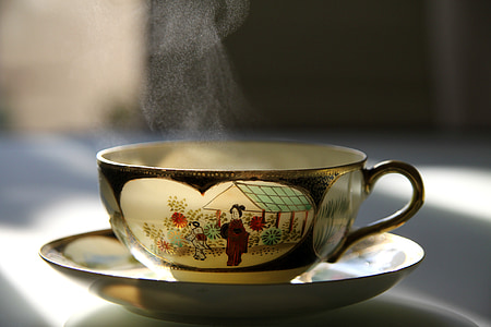 gold-black-and-white ceramic teacup and saucer thumbnail