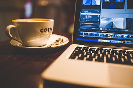 MacBook Pro beside coffee cup thumbnail