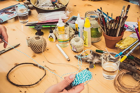 person pulling teal yarn thumbnail
