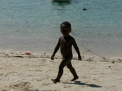 naked boy on shoreline thumbnail