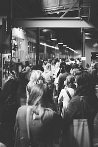 grayscale photo of lots of people on train station thumbnail