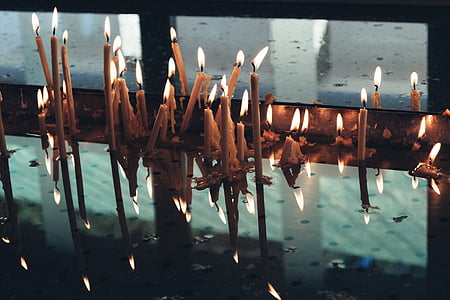 candle lot on glass tabletop thumbnail