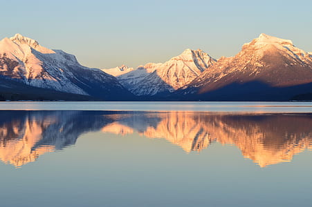 Scenic View of Lake and Mountains Against Sky thumbnail