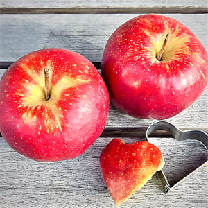 two red apples on grey surface thumbnail