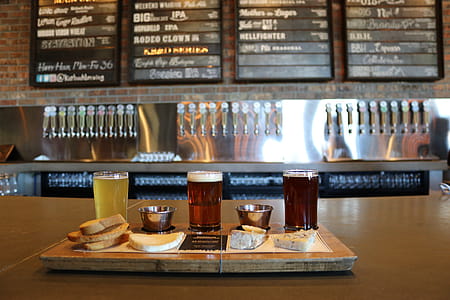 Three Glass Cups on Brown Wooden Tray With Pastries thumbnail