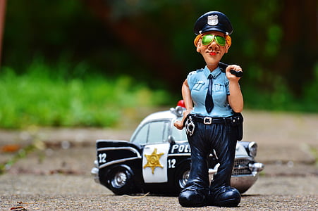 policewoman figurine standing near police vehicle toy thumbnail