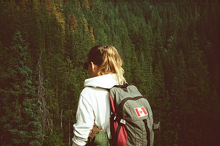 woman wearing gray and red backpack thumbnail