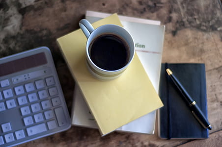 white ceramic cup filled with coffee thumbnail