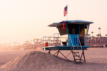 watch tower on beach during golden hour thumbnail