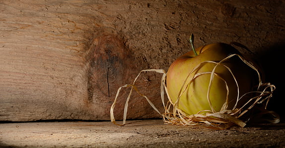 yellow apple in brown wooden table thumbnail