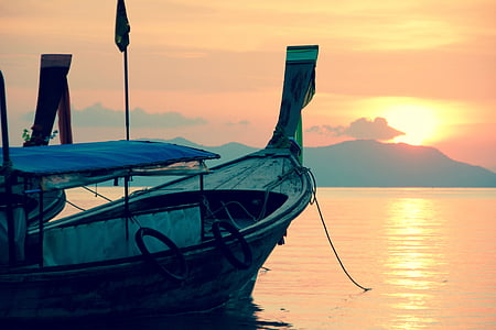 boat on body of water during sunset thumbnail