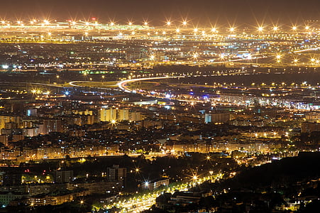 aerial photography of city buildings at night thumbnail