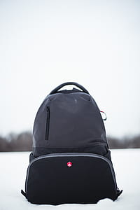 black and gray backpack on white snow thumbnail