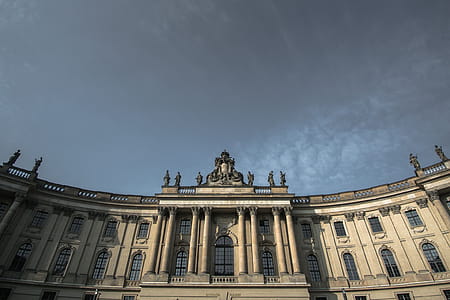 White and Gray Concrete Building Under Gray Daytime Sky thumbnail