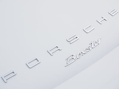 Porsche Boxster emblem in close-up photo thumbnail