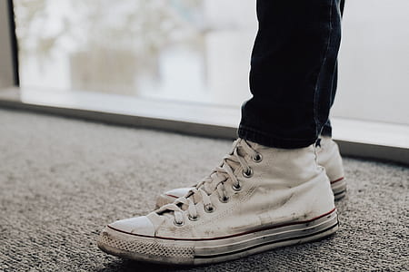 person wearing white Converse shoes thumbnail