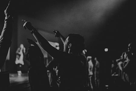 portrait photo of group of people watching concert thumbnail