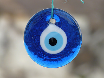shallow focus photography of evil eye pendant thumbnail