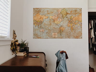 brown world map mounted on wall thumbnail