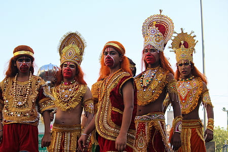 group of men wearing traditional suit taking photo thumbnail