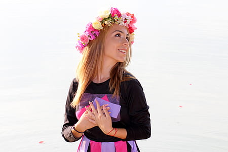 Woman in Black Purple and Pink Long Sleeve Dress and Pink Yellow and Beige Rose Headdress thumbnail