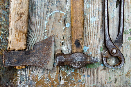 Old carpentry tools - a saw, hammer, claw hammer - old wooden table thumbnail