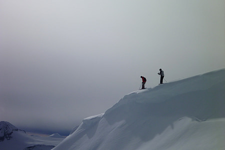 two person skiing on snow during daytime thumbnail