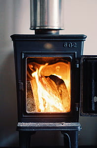 firing wood inside the firewood burner thumbnail