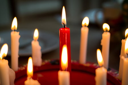 lighted red and white candles thumbnail