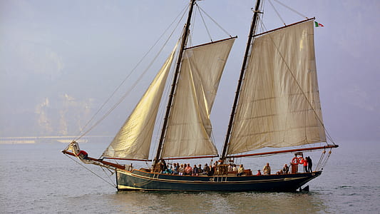 group of people riding on white sailing boat thumbnail