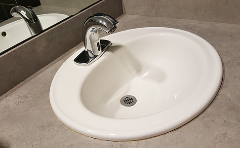 white ceramic sink and silver stainless steel faucet thumbnail