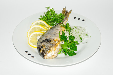 cooked fish with sliced lemon fruits thumbnail