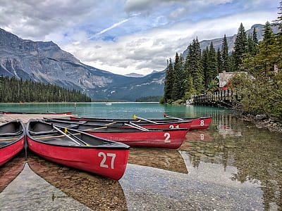 four red-and-white canoes thumbnail