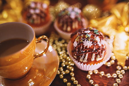 brown ceramic cup with saucer beside brown pastry thumbnail