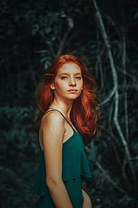 side view of woman wearing green spaghetti strap tank top thumbnail