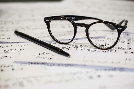 black framed eyeglasses beside black pen thumbnail