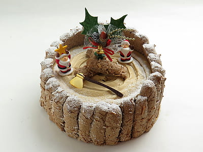 round brown and green Christmas decor on white surface thumbnail