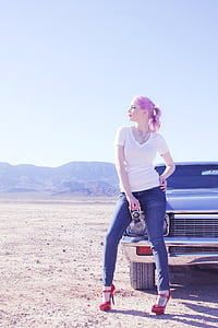 woman standing beside car thumbnail