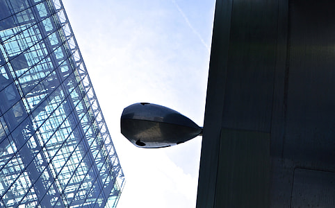 low angle photography of gray metal post thumbnail