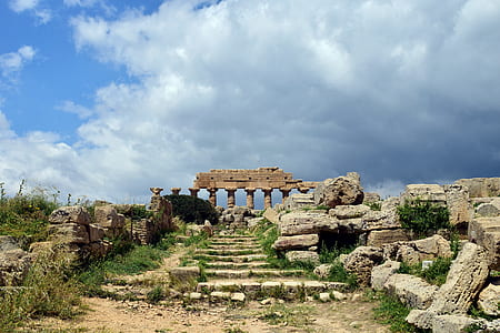 brown ruins under cloudy daytime thumbnail