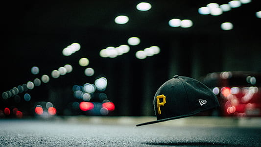 Black and Yellow P Cap Hanging in the Air thumbnail